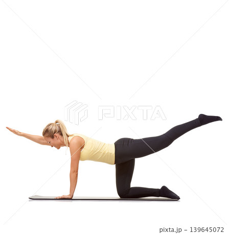 Woman, back extension and balance on floor in studio for exercise, workout or stretching body on mockup white background. Yoga, profile and healthy training with strong core, fitness or bird dog pose Woman, back extension and balance on floor in studio for exercise, workout or stretching body on mockup white background. Yoga, profile and healthy training with strong core, fitness or bird dog pose 139645072