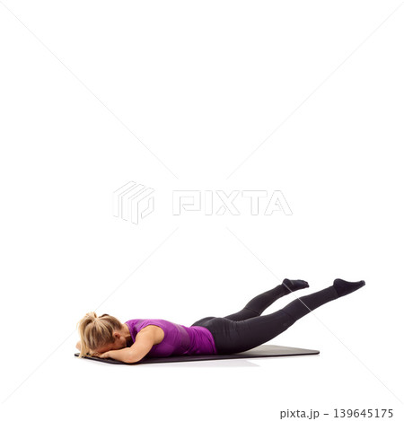 Yoga, health and floor with woman in studio for stretching, exercise and wellness. Workout, fitness and self care with female person on mat of white background for pilates, body and mockup space Yoga, health and floor with woman in studio for stretching, exercise and wellness. Workout, fitness and self care with female person on mat of white background for pilates, body and mockup space 139645175