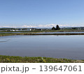 水を張った水田と雪山連峰の全景　北海道旭川西神楽 139647061