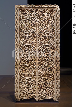 Abu Dhabi, United Arab Emirates - Jan 17 2024, close-up view of a marble carved architectural panel depicting the tree of life, on exhibition of museum Louvre Abu Dhabi, UAE 139647321