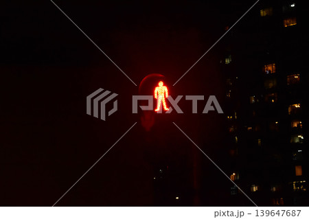 Pedestrian don't walk signal, Pedestrian signal with red light , Traffic lights and walk signs in Hong Kong at night. With blurred buildings background. Hong Kong Cityscape.  139647687