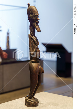 Abu Dhabi, United Arab Emirates - Jan 17 2024, close up view of the exhibit an ancestor figurine made of wood, on exhibition of museum Louvre Abu Dhabi, UAE Abu Dhabi, United Arab Emirates - Jan 17 2024, close up view of the exhibit an ancestor figurine made of wood, on exhibition of museum Louvre Abu Dhabi, UAE 139647825