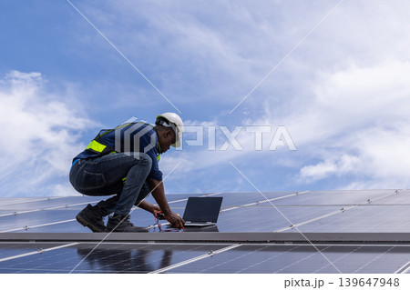 Engineer service check installation solar cell on the roof of factory. Engineer service check installation solar cell on the roof of factory. 139647948