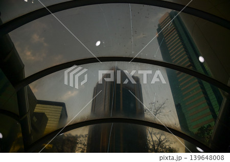 The scene of skyscapers of Hong Kong from low angle view from the tunnel. Hong Kong cityscape. Modern Buildings. Building exterior. Travel concept. The scene of skyscapers of Hong Kong from low angle view from the tunnel. Hong Kong cityscape. Modern Buildings. Building exterior. Travel concept. 139648008