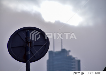 Close-up of the back of the road sign in Hong Kong with the blurred buildings in the background. Hong Kong Cityscape. Close-up of the back of the road sign in Hong Kong with the blurred buildings in the background. Hong Kong Cityscape. 139648036