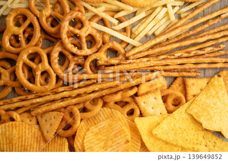 Mix of variety snack chips pretzel and cracker, junk crunchy food. Mix of variety snack chips pretzel and cracker, junk crunchy food. 139649852