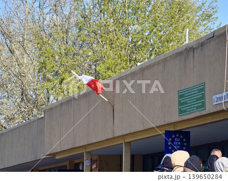 Przemysl, Poland - April 23, 2026: The Polish flag and EU sign at a checkpoint in Przemysl on the border with Ukraine Przemysl, Poland - April 23, 2026: The Polish flag and EU sign at a checkpoint in Przemysl on the border with Ukraine 139650284