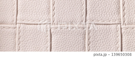 Texture light beige leather background with quilted stitched pattern, macro. Abstract pastel nude upholstery surface 139650308