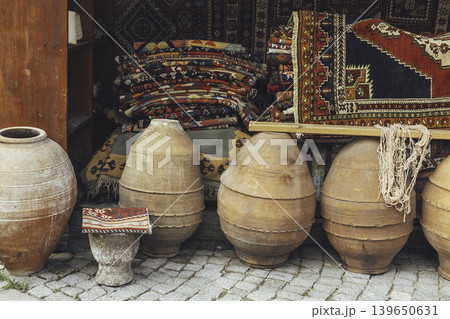 Traditional handmade carpets and clay pots at Turkish street market Traditional handmade carpets and clay pots at Turkish street market 139650631