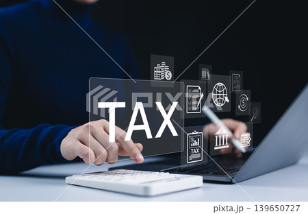 Income tax, A person calculates taxes using calculator and laptop. Icons related to finance, tax documents, and savings, represent the concept of annual tax return preparation and financial management 139650727
