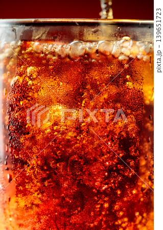 Fizz sparkling cola bubbly soda pop with ice cubes. Fizz sparkling cola bubbly soda pop with ice cubes. 139651723