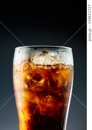 Fizz sparkling cola bubbly soda pop with ice cubes. 139651727