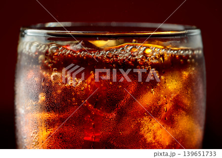 Fizz sparkling cola bubbly soda pop with ice cubes. Fizz sparkling cola bubbly soda pop with ice cubes. 139651733