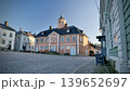 Porvoo, Finland - December 08, 2020: Historic architecture in a charming cobblestone square, showcasing beautiful colors and details of the building against a clear blue sky 139652697