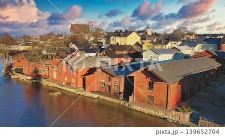 Porvoo, Finland - December 08, 2020: Scenic view of colorful wooden houses along the riverbank in Finland, showcasing charming architecture and natural beauty 139652704
