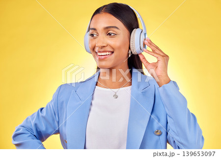 Headphones, smile or businesswoman streaming music or thinking of podcast on yellow background. Happy, relax or entrepreneur listening to radio song or audio sound on subscription playlist on a break Headphones, smile or businesswoman streaming music or thinking of podcast on yellow background. Happy, relax or entrepreneur listening to radio song or audio sound on subscription playlist on a break 139653097