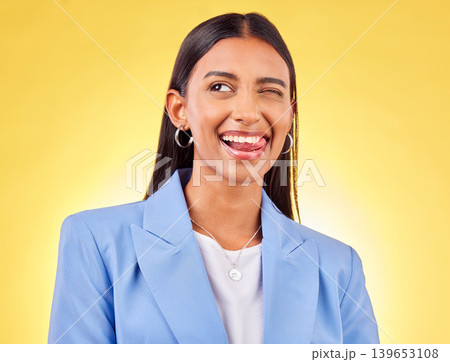 Funny, business woman and smile with silly and tongue out in a studio. Comedy, female employee and yellow background with emoji and comedy face of a employee with modern fashion and trendy style Funny, business woman and smile with silly and tongue out in a studio. Comedy, female employee and yellow background with emoji and comedy face of a employee with modern fashion and trendy style 139653108