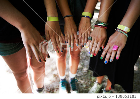 Hands, manicure and woman friends at music festival together, in a circle outdoor closeup from above. Party, concert or show with a group of people at a carnival for performance or entertainment 139653183