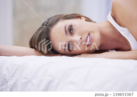 Woman, happy and peaceful in bed on weekend, lazy and comfortable on morning at home. Female person, smiling and satisfaction while resting in bedroom, wake up and good mood on vacation or holiday Woman, happy and peaceful in bed on weekend, lazy and comfortable on morning at home. Female person, smiling and satisfaction while resting in bedroom, wake up and good mood on vacation or holiday 139653367