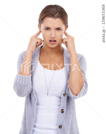 Noise, portrait or woman with fingers in ears in studio for volume control, sensitive or block on white background. Annoyed, stop or model with not listening gesture, sound or frustrated by tinnitus Noise, portrait or woman with fingers in ears in studio for volume control, sensitive or block on white background. Annoyed, stop or model with not listening gesture, sound or frustrated by tinnitus 139653369