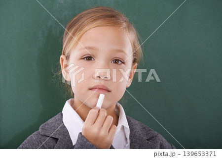 Child, chalk and board or portrait thinking in classroom education, development or solution. Female person, face and thoughts as student for writing lesson or creative idea, mockup or brainstorming Child, chalk and board or portrait thinking in classroom education, development or solution. Female person, face and thoughts as student for writing lesson or creative idea, mockup or brainstorming 139653371