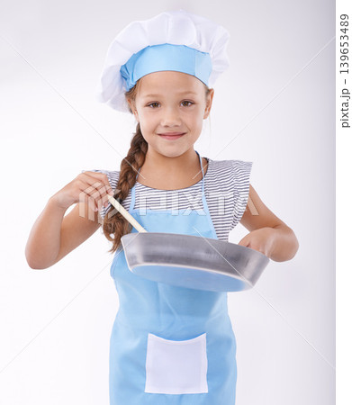 Child, chef and portrait with apron, confident and development on white background. Culinary skills, happy and learning to cook, food and childhood growth with confidence in hospitality industry Child, chef and portrait with apron, confident and development on white background. Culinary skills, happy and learning to cook, food and childhood growth with confidence in hospitality industry 139653489