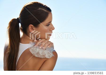 Ice, sports and back of woman with injury, pain or hurt shoulder for outdoor cardio training. Fitness, accident and female athlete with frost pack for inflammation, bruise or sore muscle of running. 139653581