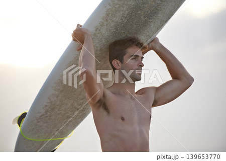 Fitness, beach and man carrying surfboard for wellness, sports and training nature. Ocean, exercise and profile of male surfer at the sea for vacation adventure, travel and journey, hobby or holiday 139653770