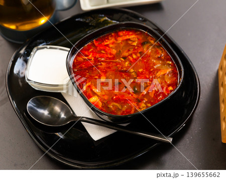 Russian cuisine - solyanka soup with various ingredients closeup Russian cuisine - solyanka soup with various ingredients closeup 139655662