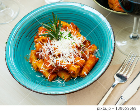 Rigatoni pasta with tomato sauce, goat cheese Rigatoni pasta with tomato sauce, goat cheese 139655669