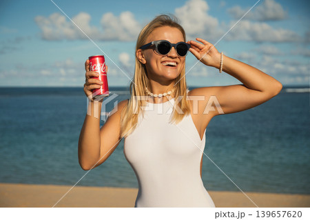 Bali, Indonesia, March 18, 2026: Coca-Cola drink at the beach Bali, Indonesia, March 18, 2026: Coca-Cola drink at the beach 139657620