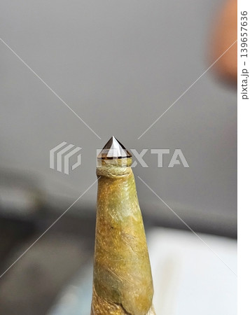 Faceted Cognac Gemstone on Dop Stick for Jewelry Making and Lapidary Process Faceted Cognac Gemstone on Dop Stick for Jewelry Making and Lapidary Process 139657636