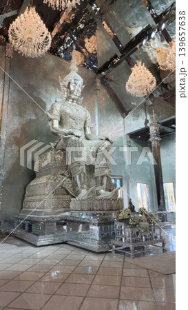 Large Silver Buddha Statue in Reflective Crystal Hall of a Thai Temple Large Silver Buddha Statue in Reflective Crystal Hall of a Thai Temple 139657638