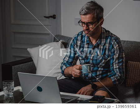 Focused remote employee working in home office Focused remote employee working in home office 139659361