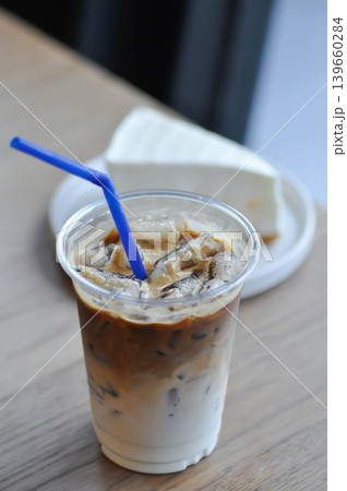 iced coffee , iced latte coffee or iced cappuccino coffee and coconut cake iced coffee , iced latte coffee or iced cappuccino coffee and coconut cake 139660284