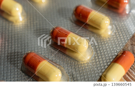 Orange medicine pills closeup, macro tablets Orange medicine pills closeup, macro tablets 139660545