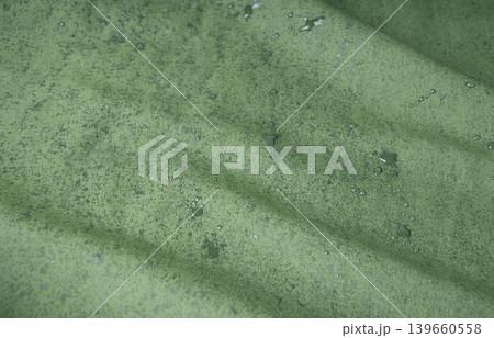 Waterproof fabric texture with rain drops closeup Waterproof fabric texture with rain drops closeup 139660558