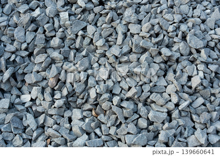 Construction gravel pattern, crushed grey stone textured background Construction gravel pattern, crushed grey stone textured background 139660641