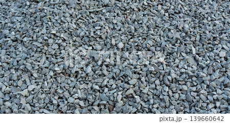 Construction gravel pattern, crushed grey stone textured background Construction gravel pattern, crushed grey stone textured background 139660642