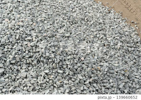 Construction gravel pattern, crushed grey stone textured background Construction gravel pattern, crushed grey stone textured background 139660652