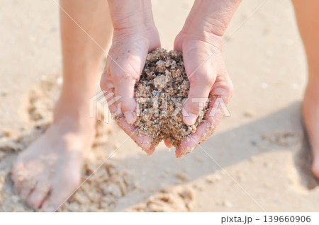 sand, holding sand or beach sand or sea sand or play sand sand, holding sand or beach sand or sea sand or play sand 139660906