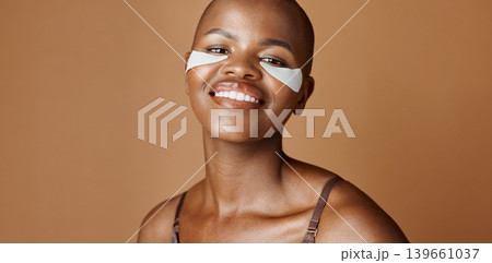 Skincare, health and face of black woman in studio with glowing, natural and facial routine. Smile, cosmetic and portrait of African person with dermatology beauty treatment by brown background. 139661037