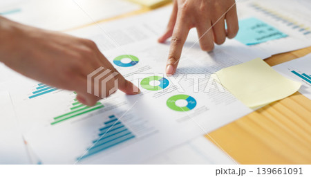 Hands, business people in meeting and data analysis, review paperwork with graphs and info, team doing market research. Stats, analytics and infographic documents with sticky note and collaboration Hands, business people in meeting and data analysis, review paperwork with graphs and info, team doing market research. Stats, analytics and infographic documents with sticky note and collaboration 139661091