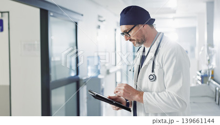 Man, doctor and tablet for hospital, healthcare or clinic research, online planning and schedule management. Medical professional or surgeon typing on digital technology for surgery results or data Man, doctor and tablet for hospital, healthcare or clinic research, online planning and schedule management. Medical professional or surgeon typing on digital technology for surgery results or data 139661144