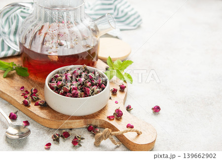 Glass teapot brewing herbal rose bud tea Glass teapot brewing herbal rose bud tea 139662902