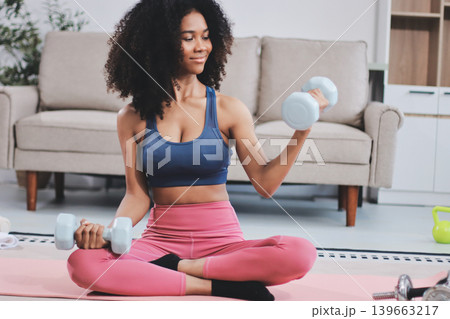 Women exercising in fitness studio yoga classes Women exercising in fitness studio yoga classes 139663217