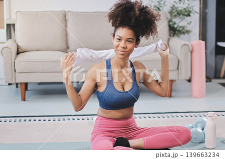 Women exercising in fitness studio yoga classes Women exercising in fitness studio yoga classes 139663234