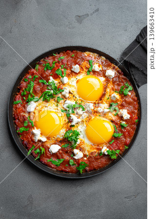 Delicious Shakshuka Eggs Breakfast in frying pan Delicious Shakshuka Eggs Breakfast in frying pan 139663410