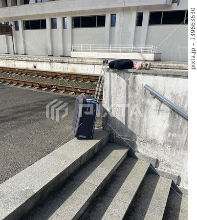 a suitcase on the rail station a suitcase on the rail station 139663630