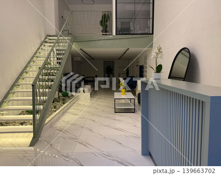 A long hallway in a hospital shows empty waiting chairs and glas 139663702